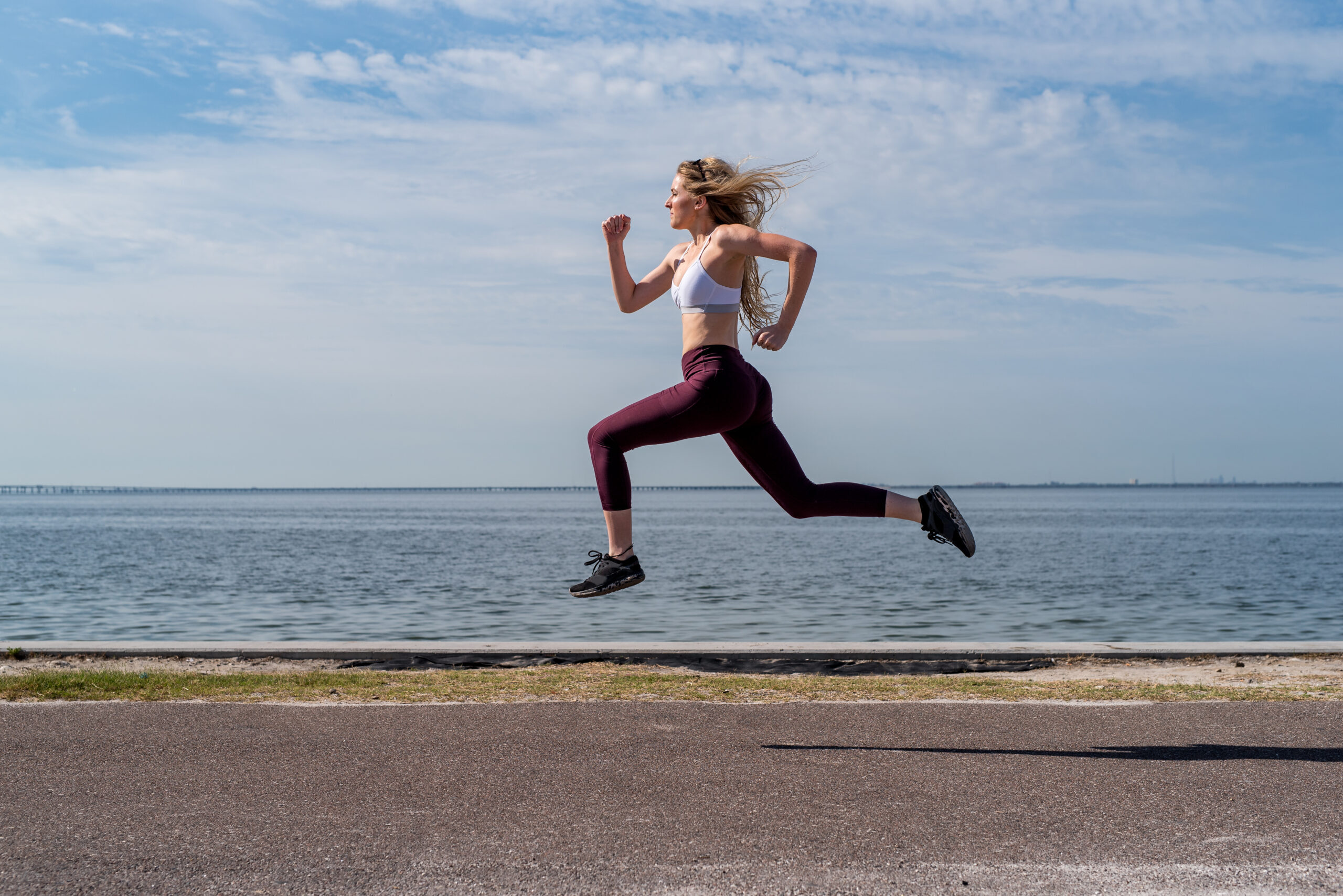 woman running on the Courtney Campbell causeway